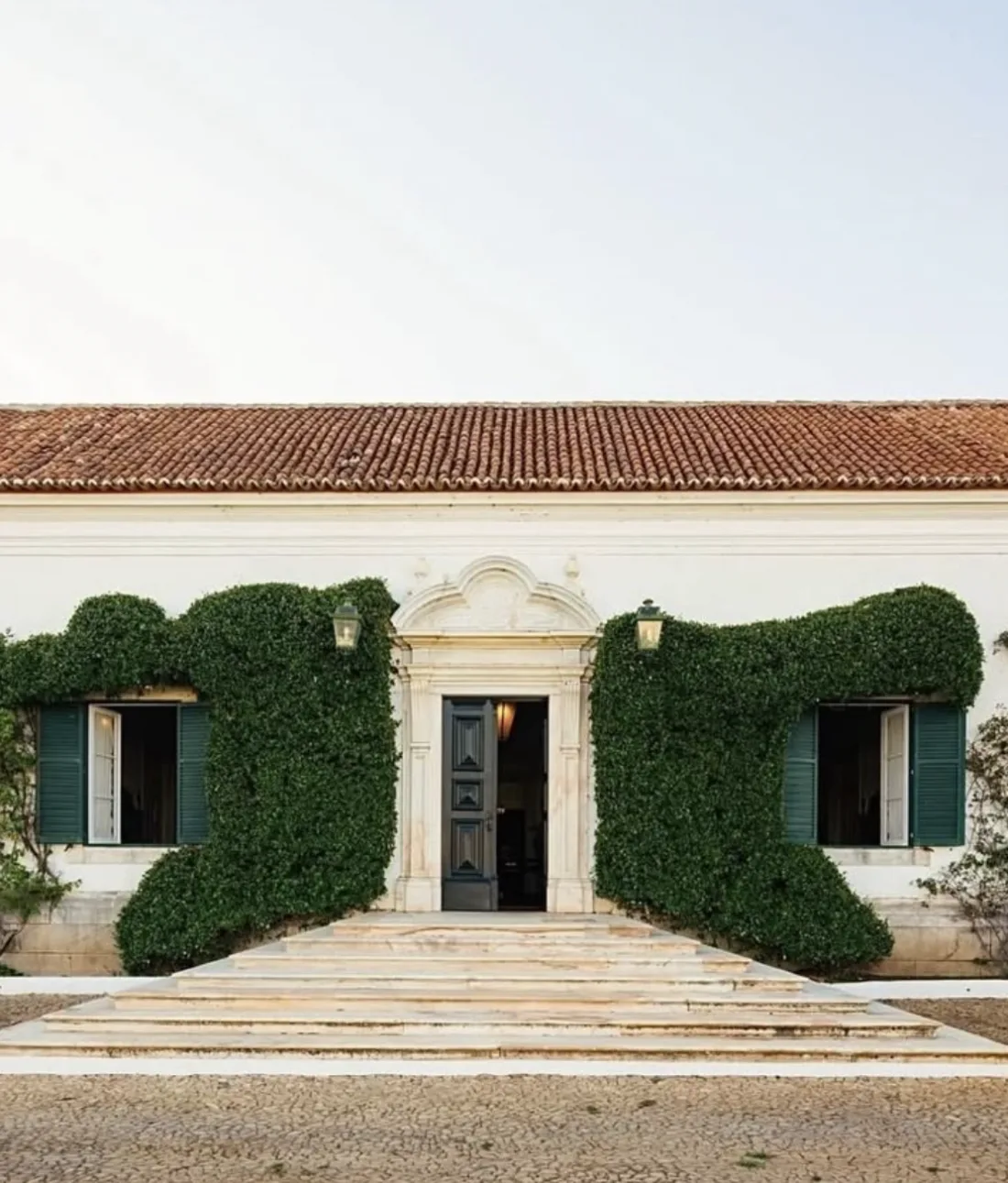 AD100 studio — ivy-clad villa entrance
