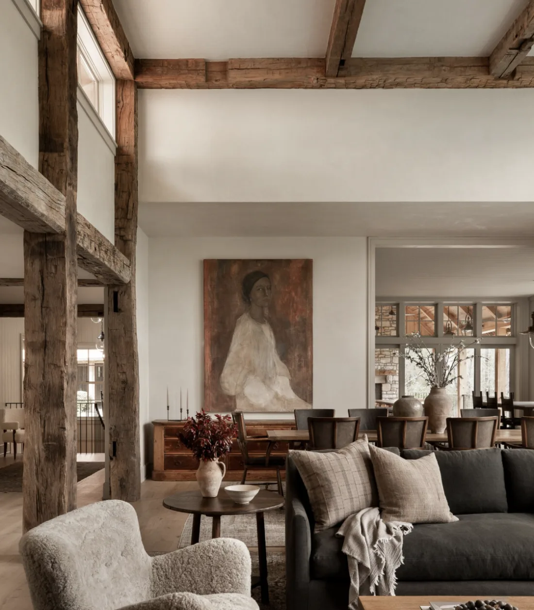 Amber Interiors — timber-beamed living room with portrait