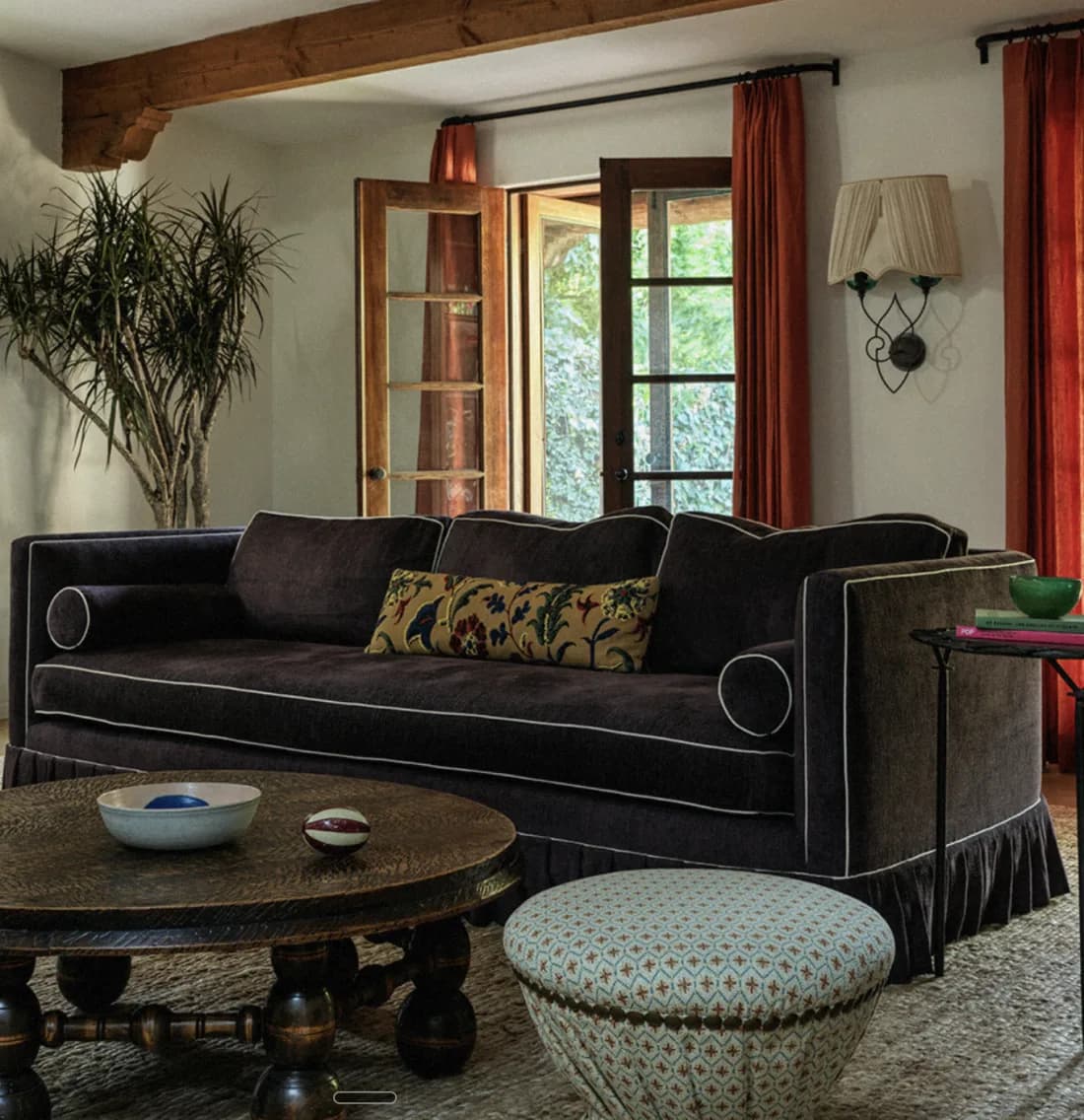 Garance Rousseau — living room with velvet sofa and garden doors