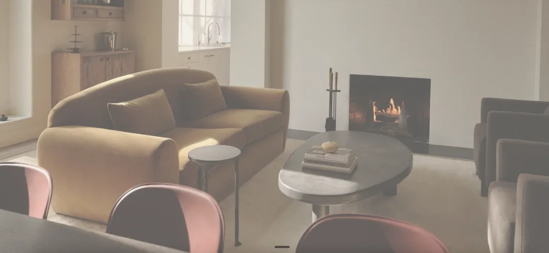 Lucie Project — sitting room with fireplace and camel sofa