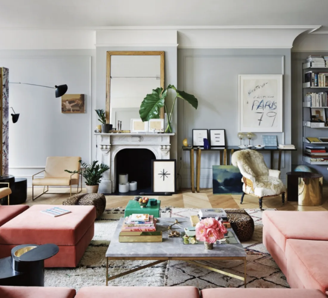 Meyer Davis — living room with fireplace and coral ottoman