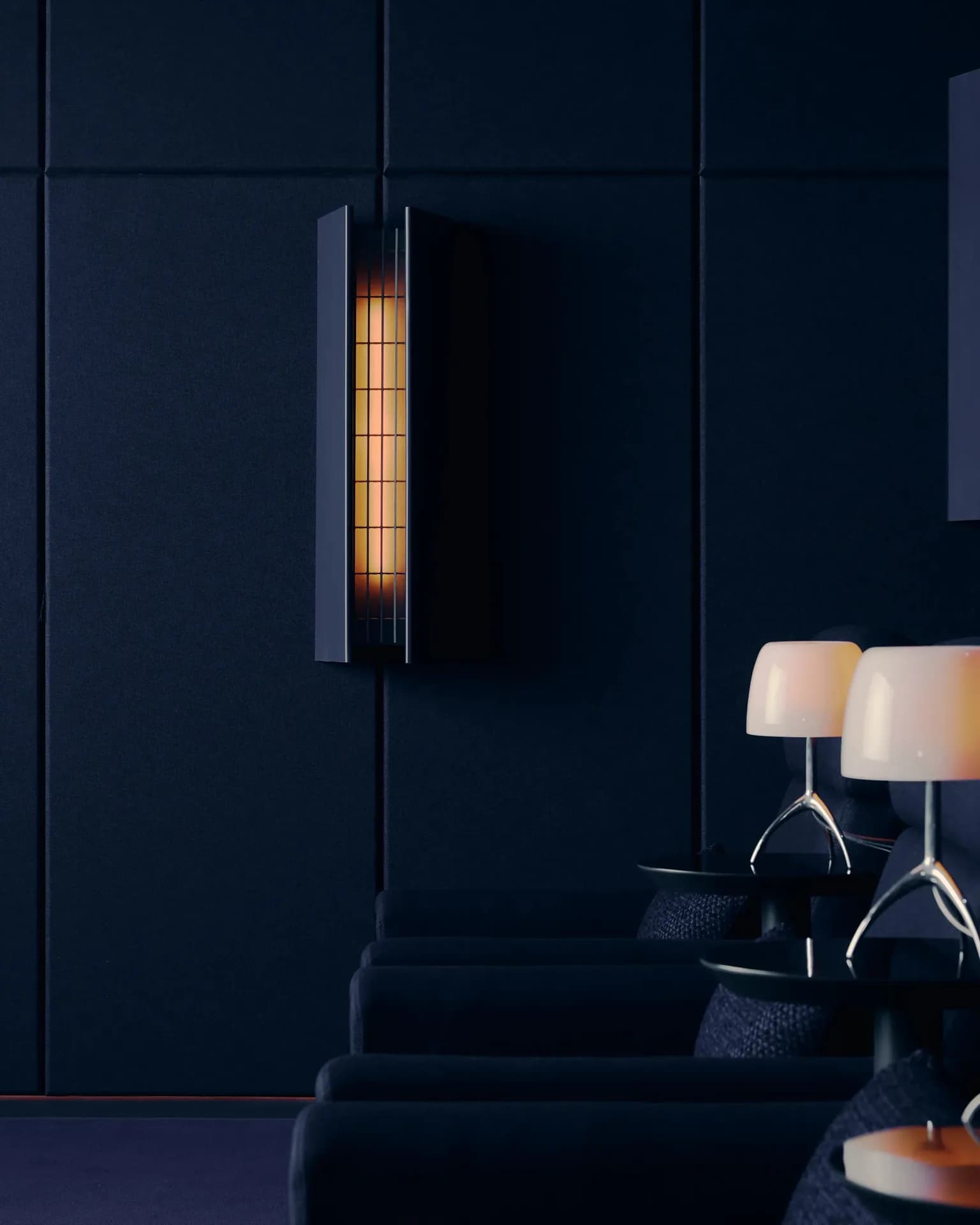 Dark blue lounge with upholstered wall panels and glowing sconce